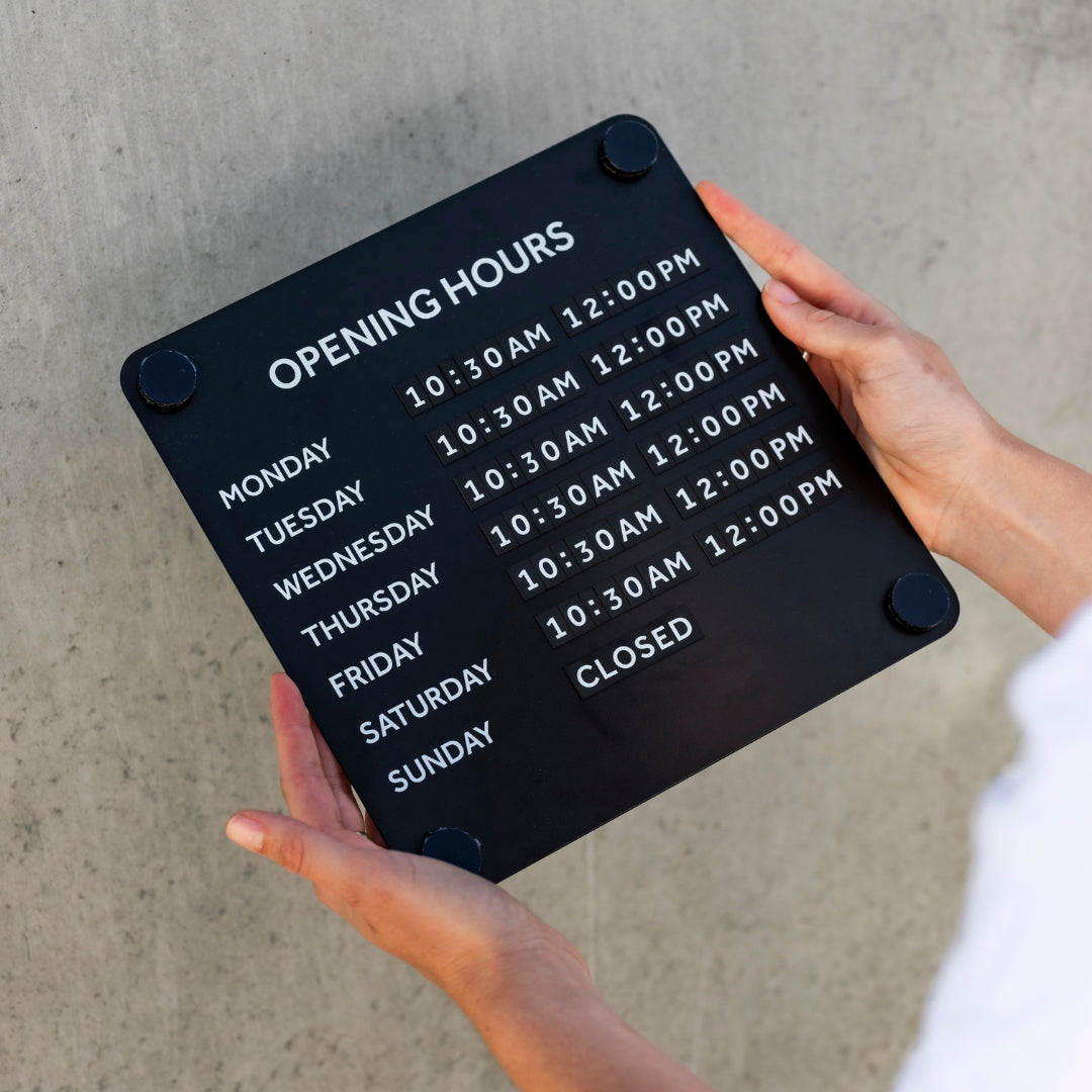 Black magnetic opening hours sign