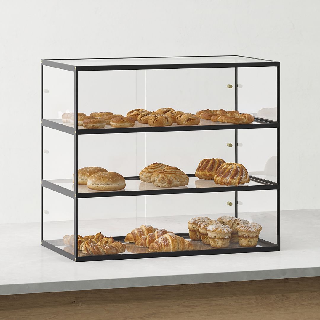 Black tiered acrylic display case for pastries